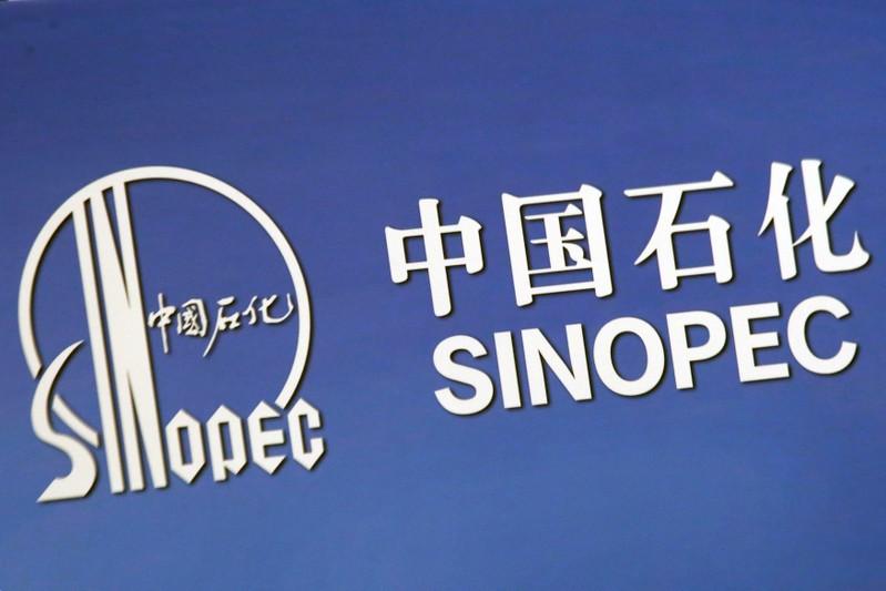 FILE PHOTO: The company logo of China's Sinopec Corp is displayed at a news conference in Hong Kong, China March 26, 2018. REUTERS/Bobby Yip/File Photo